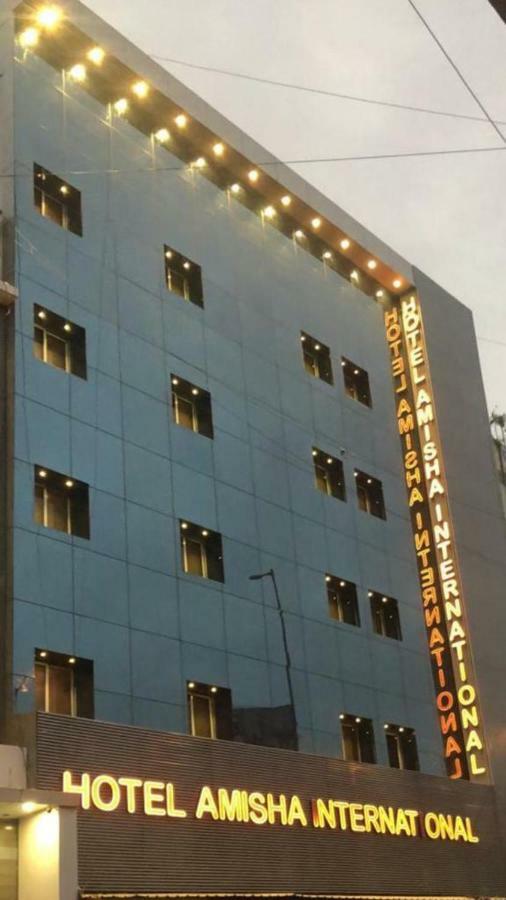 Hotel Amisha International Surat Dış mekan fotoğraf
